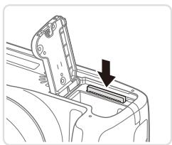 CANON POWERSHOT SX50 HS - Retirez la batterie. - 1