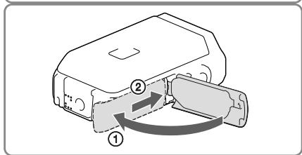 SONY HDR-GW66 - Schlieben Sie die Akkufach-/ Speicherkartenfach-/ Buchsenabdeckung. - 2
