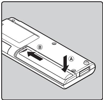 OLYMPUS WS-650 DNS - Appuyez légèrement sur la flèche et faites coulisser le couvercle du logement de la pile pour l'ouvrir. - 3