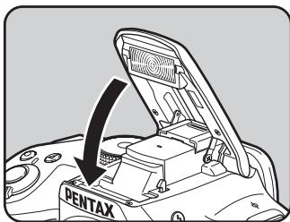 PENTAX K50 - Appuyez sur le haut du flash pour rétractor le flash incorpore. - 1