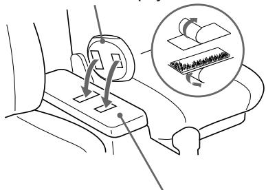 Diagram illustrating car seatbelt mechanism with labeled components and directional arrows indicating movement