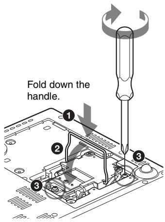 Fold down the handle.