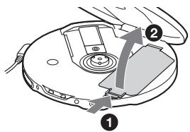 Diagram of a CD or DVD disc with labeled parts and directional arrows indicating movement or assembly.