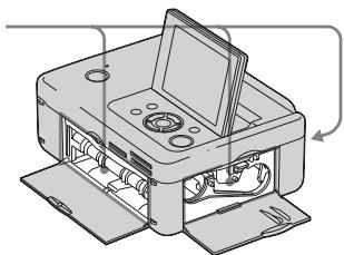 SONY DPP-FP75 - Retirez le magasin à papier et le ruban encreur de l'imprimante, et vérifie s'il n'y a pas de papier coince à l'intérieur. - 1