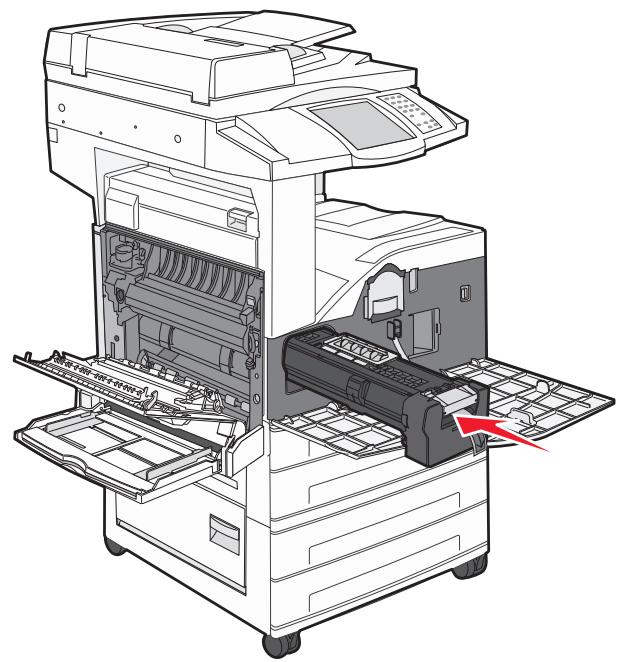 Diagram of an open industrial machine with internal components and a red arrow indicating a specific part (no text or symbols present)