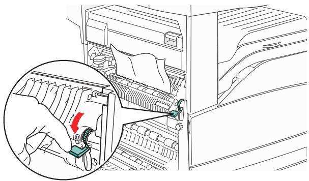 Line drawing of a hand inserting a component into a rack, showing internal structure and a magnified view (no text or symbols).