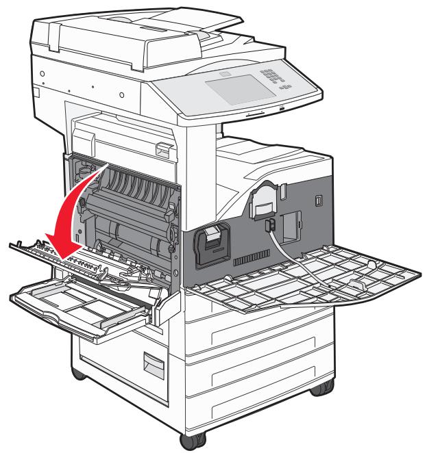 Diagram of an open industrial machine with internal components and a red arrow indicating a process or operation (no text or symbols present).