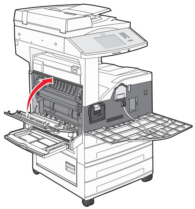 Diagram of an open industrial machine with internal components and a red arrow indicating a process flow (no text or symbols present)