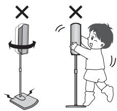 Illustration showing a child using a stand to stop equipment, with 'X' symbols indicating absence or prohibition.