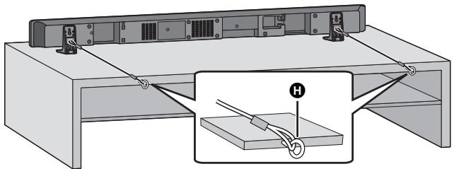 PANASONIC SC-HTB520 - Das Gerät in der gewündsten Position aufstellen und jeder Schnur am Regal oder Tisch befestigen. - 1