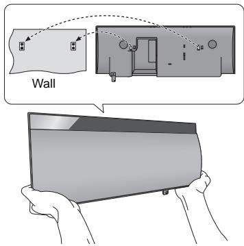 PANASONIC SC-NE1 - Hook the unit securely onto the wall mount brackets with both hands. - 1