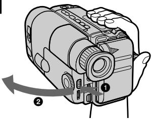 Diagram of a camera with labeled parts and directional arrow indicating rotation or movement