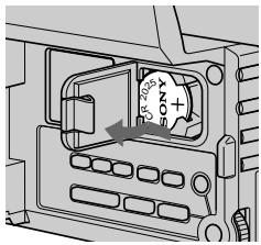 Technical diagram showing a device panel with labeled components and directional arrows indicating movement or flow.