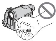 Illustration of a hand holding a device with a prohibition symbol (no text or labels)