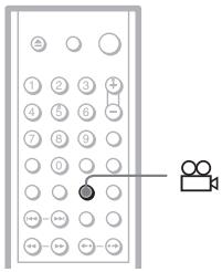 Diagram of a mobile phone with numbered keypad and a video camera icon connected to the right side.