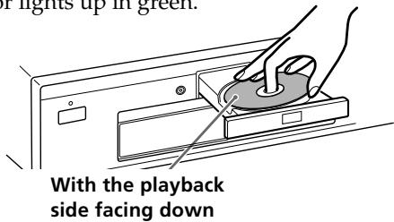 SONY DVP-S345 - Press ≅ on the player and place a disc on the disc tray. - 1