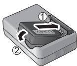 PANASONIC DMC-TZ20 - Insérez les bornes de batterie et fixez la batterie au chargeur - 1