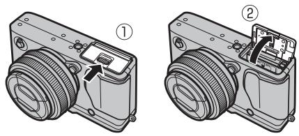 FUJI APPAREIL PHOTO A OBJECTIF INTERCHANGEABLE X-E1 NOIR 18-55MM - Ouvrez le couvercle du compartment de la batterie. - 1