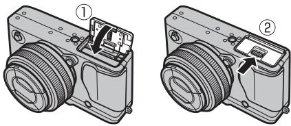 FUJI X-E1 - Fermez le couvercle du compartment de la batterie. - 1