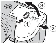 NIKON COOLPIX L330 - Mettez l'appareil photo hors tension puis ouvre le volet du logement pour accumulator/carte mémoire. - 1