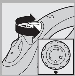 Diagram illustrating a mechanical or fluid system with labeled components and directional arrows, including a magnified inset showing circular features.