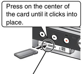 Press on the center of the card until it clicks into place.