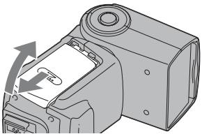 SONY HVL-F42AM - Ouvrir le compartiment des piles comme indiqué. - 1