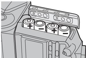 SONY HVL-F56AM - Legen Sie die Batterien wie in der Abbildung dargestellt in das Batteriefach ein. - 1