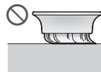 Diagram illustrating a mechanical assembly process with labeled steps ① and ②, showing hand positioning and component insertion.
