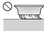 Diagram illustrating a mechanical assembly process with labeled steps ① and ②, showing hand positioning and component insertion.