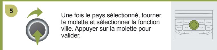 5 Une fois le pays sélectionné, tourner la molette et sélectionner la fonction ville. Appuyer sur la molette pour valider.
