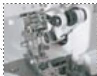 BERNINA 1200MDA - Avancement professionnel du couteau depuis le haut - 1