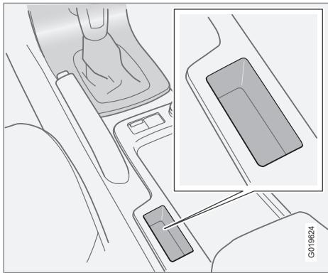 VOLVO C70 - Compartiment de rangement derrière le frein de stationnement - 1