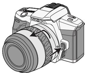 MINOLTA DYNAX 3L - Tout en appuyant sur le bouton de déverrouillage, tourner l'objet dans le sens anti-horaire jusqu'en butée. - 1