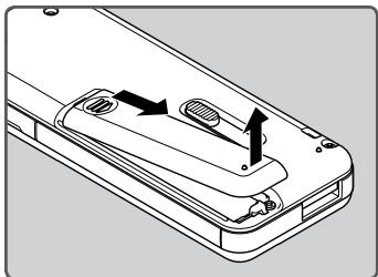 OLYMPUS WS-812 - Appuyez légèrement sur la flèche et faites coulisser le couvercle du logement de la pile pour l'ouvrir. - 1
