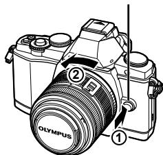 OLYMPUS OM-D E-M5 - Retrait de l'objectif de l'appareil photo - 1