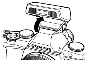 OLYMPUS OM-D E-M5 - Pour utiliser le flash, relevez la tête de flash. - 1