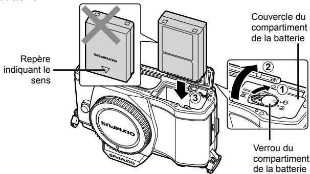 OLYMPUS OM-D E-M5 - Insertion de la batterie. - 1