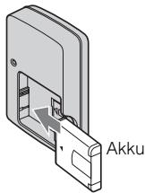 SONY CYBER-SHOT DSC-WX1 - Setzen Sie den Akku in das Ladegerät ein. - 1