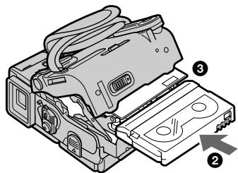 Technical diagram of a cassette tape device with numbered parts and directional arrow indicating assembly or component