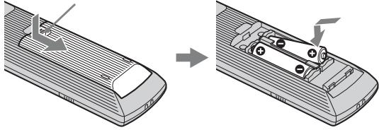 SONY KDS-55A2000 - To insert batteries into the remote - 1