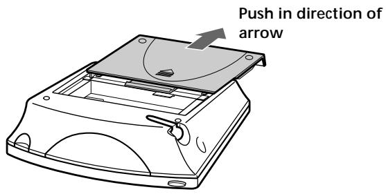 Push in direction of arrow