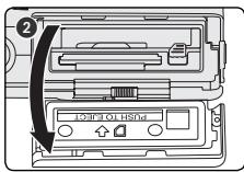 NIKON COOLPIX S2 - Ouvrez le volet du logement pour carte mémoire ou pour accumulateur. Faites glisser le volet dans la direction indiquée en (1) jusqu'à ce qu'il s'ouvre (2). - 2