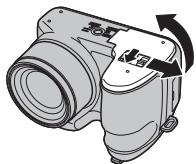 FUJIFILM S1800 - Ouvrez le couvercle du compartiment des piles. - 1