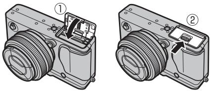FUJIFILM X-E1 - Fermez le couvercle du compartiment de la batterie. - 1