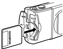 OLYMPUS C-200 ZOOM - Insérer la carte SmartMedia dans l'appareil comme montré sur l'illustration, en veillant à ce qu'elle soit enforcée au maximum. - 1