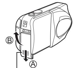 OLYMPUS C-460 ZOOM - Faites glisser le couvercle du compartiment des piles vers Ⓐ. - 1