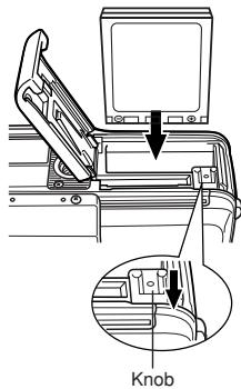 OLYMPUS C-50 ZOOM - ■ Loading the battery Insert the battery in the correct direction in the battery/card compartment. - 1