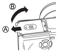 OLYMPUS C-765 UZ - Mise en place de la batterie Alignez la batterie comme indiqué et insérez-la dans le compartiment de batterie jusqu'à ce qu'elle se verrouille en position avec son bouton de blocage. - 1