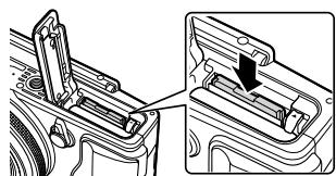 OLYMPUS XZ-2 - Pour retirer la carte mémoire - 1